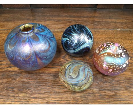 Two Peter Layton paperweights, with an apple paperweight and an un-signed irridescent squat vase (4)
