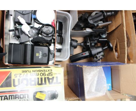 A box of camera accessories to include tripod fittings, camera cases, Tamran SP90mm F2.5 extension tube (boxed), National PE-