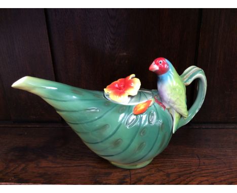 A Jameson & Tailor  teapot, having a floral finial to the cover, & parot to the handle.