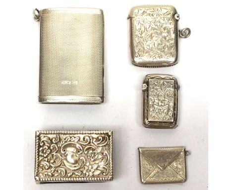 A collection of silver smokers companions, including a George V engine turned vesta case, Birmingham 1931; a small vesta case