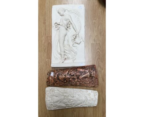 Two plaster casts depicting Madonna and Child together and another plaque depicting a classical figure