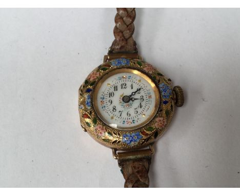  A ladies 18ct gold and enamel early wristwatch, floral details in pink, blue and green enamel, dial diameter approx 23mm,  o