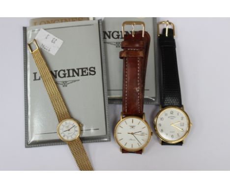 A 9ct Longines ladies wristwatch, a gentleman's Longines gold plated wristwatch and another, Rotary (3) (paperwork for both L