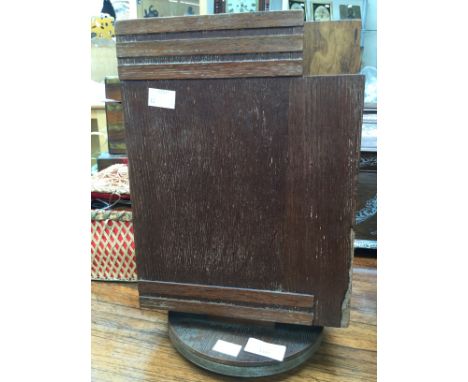 An Art Deco oak bookstand with a plaque inscribed 'Telebook Revolving Stand, Pro Pat 5895/84' 