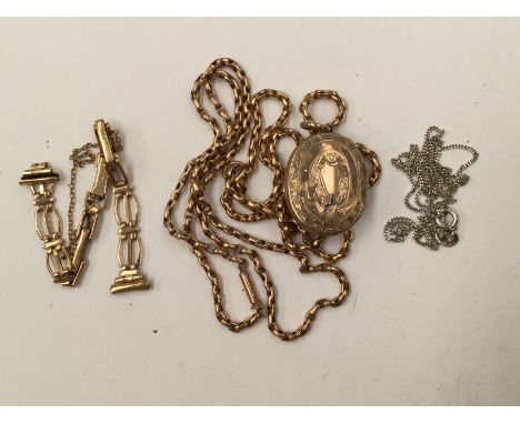 A yellow metal oval locket, enamelled crucifix on 9ct chain; 9ct watch bracelet; 9ct chain; 24.7 grams gross; an 18ct white g