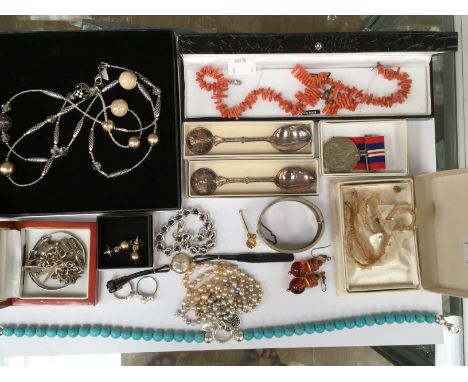 A collection of costume jewellery including Victorian plated meatl cuff, a silver charm bracelet and expanding bangle, a stan