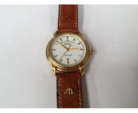 A Maurice Lacroix ladies wrist watch, having white enamel Arabic numeral dial with yellow metal batons, day and date aperture