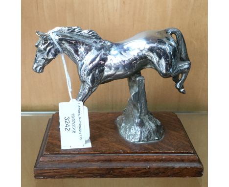 A 1920s chrome car mascot, of a horse jumping a gate
