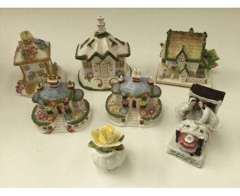 A collection of five Coalport cottage figures, comprising 'The Gate House', 'Keepers Cottage', 'The Masters House', 'The Summ