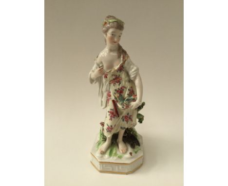 A Derby figure of 'Water' one of The Elements, a girl carrying a fishing net and  fishes at her feet and in her apron, incise
