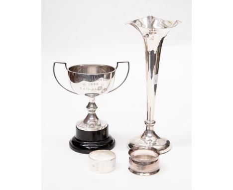 An Edwardian silver plain trumpet shaped vase, Birmingham, 1908, weighted, together with with a George V two handled cup on w