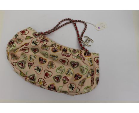 CHANEL Small Valentine handbag, featuring light pink canvas multicoloured heart print motif design, white metal hardware, due