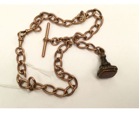A rose gold 9ct gold watch fob chain with a gilt metal fob set with camelian, toggle clasp and T.bar, approx 74.7gms