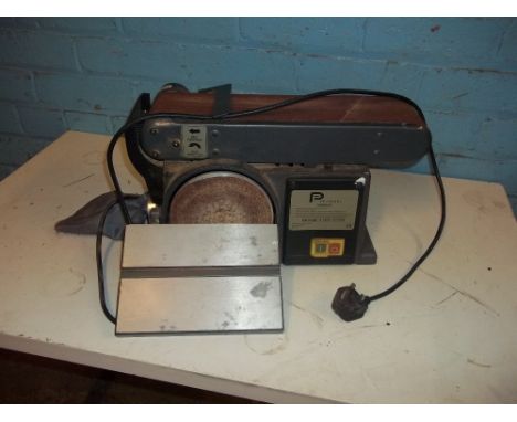 A BENCH TOP DUAL BELT SANDER AND DISK SANDER