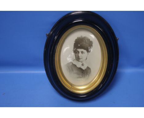 A BELLEEK PORTRAIT PLAQUE OF A VICTORIAN LADY IN A EBONISED FRAME 23 CM X 29 cm Condition Report: The plaque has a glaze flaw