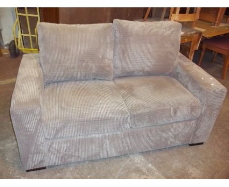 A MODERN JUMBO CHORD TWO SEATER SOFA