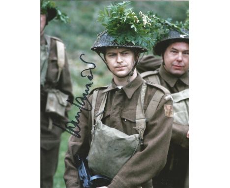 Dads Army Ian Lavender signed 10 x 8 inch colour photo on patrol. Good condition. All autographs come with a Certificate of A