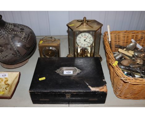 A writing slope, an Anniversary clock and a mantel clock