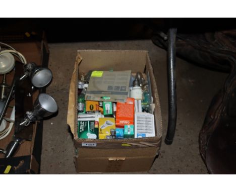 A box containing a quantity of various light bulbs