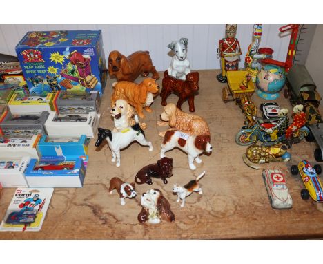 A collection of dog ornaments to include Beswick, Sylvac and Cooper Craft