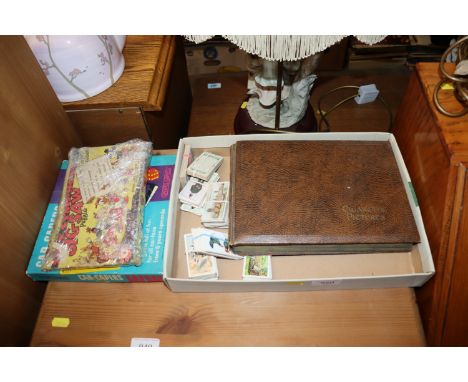 A collection of various cigarette cards, a car capers game and a vintage jigsaw puzzle 