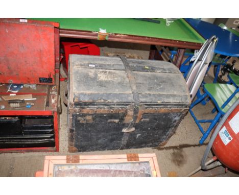 A wooden and canvas metal bound dome top trunk 