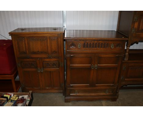 An oak Old Charm style stereo cabinet and a drinks cabinet with linenfold panel decoration