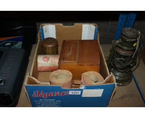 A vintage wooden coffee grinder, tea canister and three hospital toilet rolls