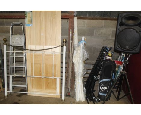 A quantity of long handled tools to include rake, hoe, etc.