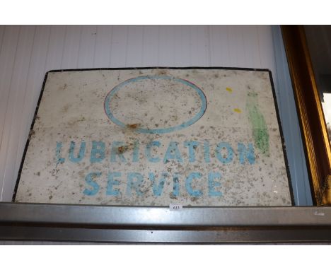 An Esso Lubrication Service advertising sign