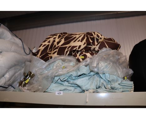 A quantity of curtains and a ceiling light