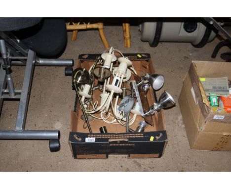 A box containing various light fittings, ceiling lights etc.
