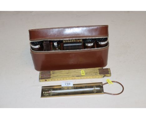 A folding ruler, a thermometer and a travelling toilet set 