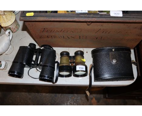A cased pair of Prinz 10 x 50 binoculars and a pair of vintage binoculars