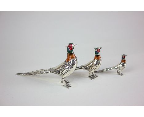 A set of three metal and enamel figures of pheasants, of graduated size, tallest 8.5cm