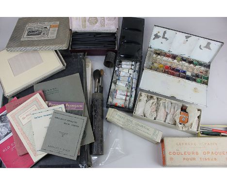 A collection of artist's materials, to include tins of Landseer and Windsor &amp; Newton watercolours, and charcoal, (most in