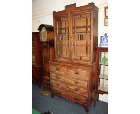 A 19th century mahogany secretaire bookcase, the glazed upper section with panelled doors and stepped surmount, above secreta