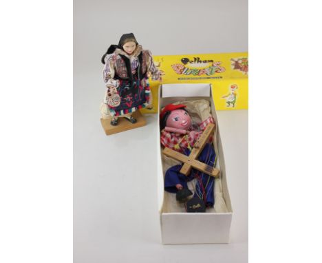 A Pelham standard puppet of a girl in gingham blouse and red felt hat, the box marked J C Father, together with a composite f