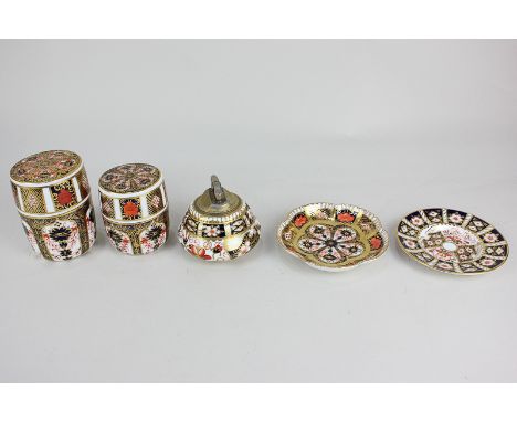 Five pieces of Royal Crown Derby porcelain including a jar and cover, a scalloped dish and a table lighter with cover (a/f) i