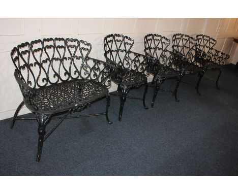 A set of four black painted metal garden chairs and a matching two-seater bench, 94cm