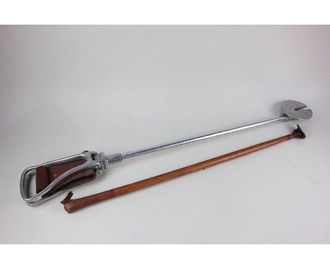 A Featherwate shooting stick and a leather riding crop