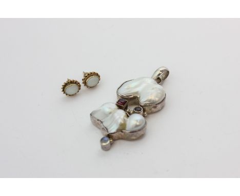 A silver mounted baroque pearl and cabochon moonstone pendant, and a pair of opal ear studs