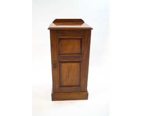 A Victorian mahogany pot cupboard, the panelled door enclosing a single shelf, 81cm high x 38cm wide x 36cm deep