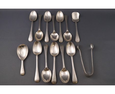 A set of eleven Victorian silver tea spoons, together with matching sugar tongs, caddy spoon and sugar spoon, each with engra