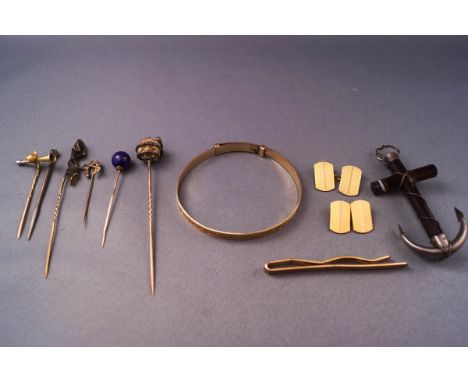 A collection of jewellery to include a banded agate cross stylized as an anchor, rolled gold expanding bangle, cufflinks and 