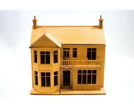 A dolls house in the form of a Victorian residence with bow front beside two storeys with a balcony, 76cm high x 75cm wide x 
