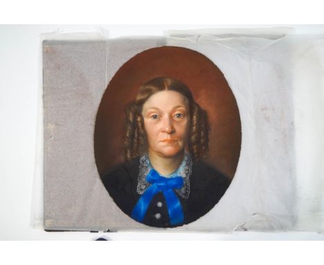Victorian School, oval portrait of a lady wearing a blue ribbon bow, pastel, 45cm x 37cm