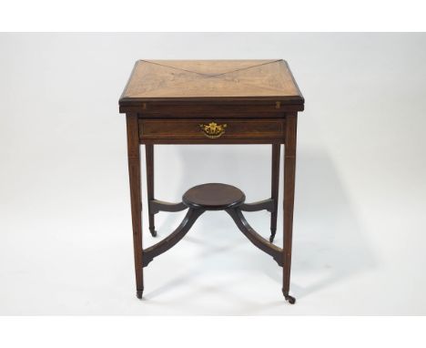 A 19th century rosewood envelope card table with single drawer upon square tapering legs joined by upswept supports and an un