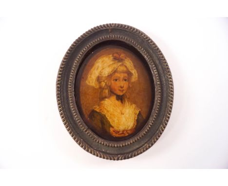 A late 18th century oval miniature portrait on glass, circa 1800, of a lady wearing blue dress with lace collar, 8.5cm x 7cm