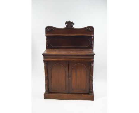 A Victorian mahogany chiffonier, the raised back with shaped shelf over one drawer and two panelled doors on plinth base, 142